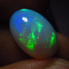 3.60 / Cts - 8.5x13mm - Oval Cut Cabochon - WELO ETHIOPIAN OPAL - Amazing Green Red Mix Fire